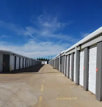 A row of storage units on the side of a road.