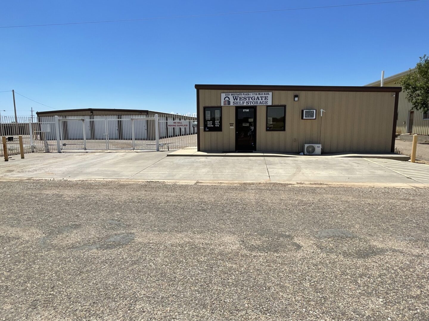 A large building with many storage units in the background.